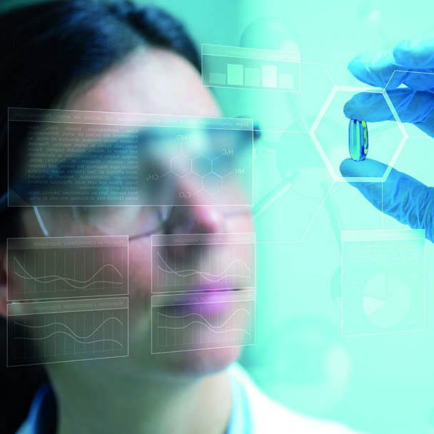 Woman examing supplement capsul Excipients and Processing Aids Can Streamline Your Finished Dosage Formulations