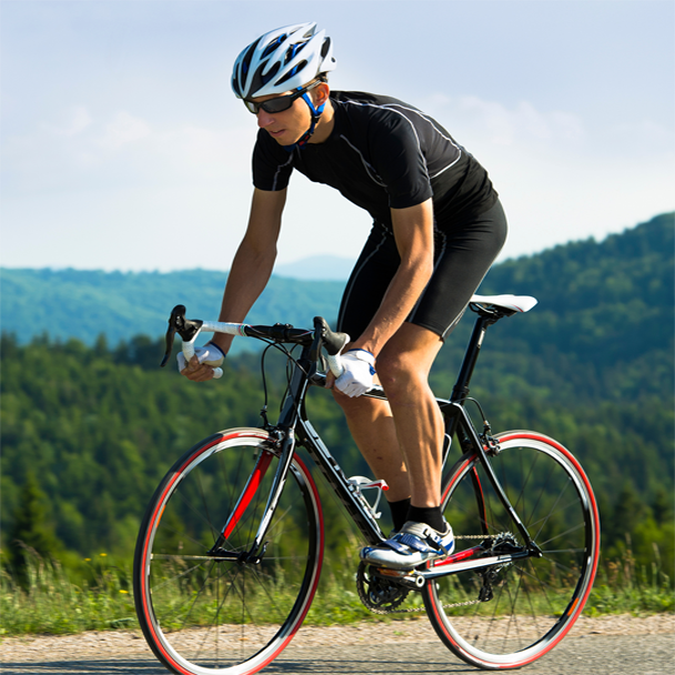 Man riding his bike on a mountain road